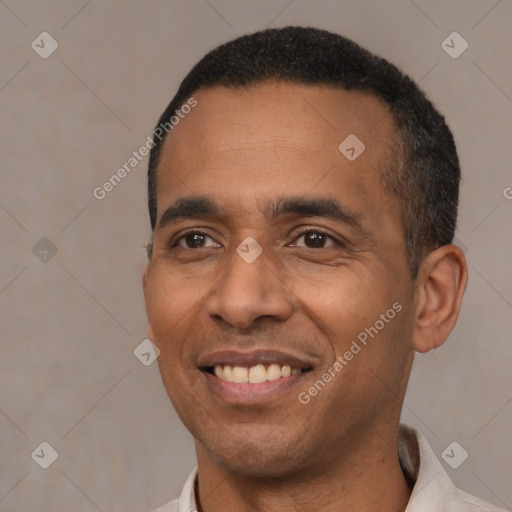 Joyful latino adult male with short  black hair and brown eyes