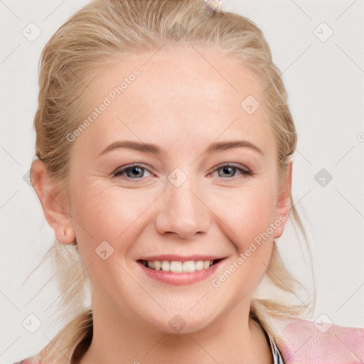 Joyful white young-adult female with long  brown hair and blue eyes