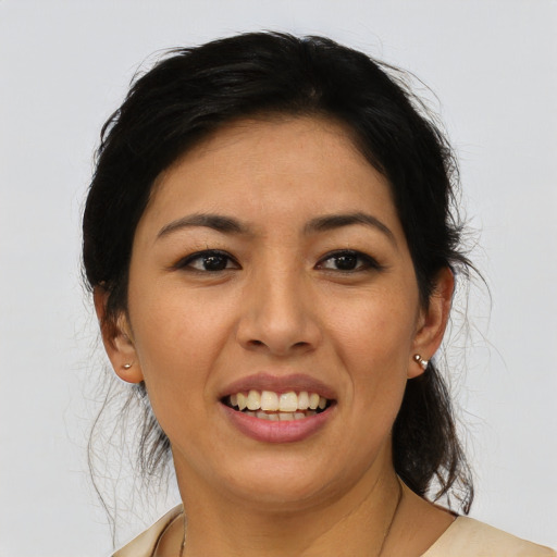 Joyful latino young-adult female with medium  black hair and brown eyes