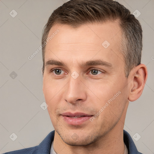 Joyful white adult male with short  brown hair and brown eyes