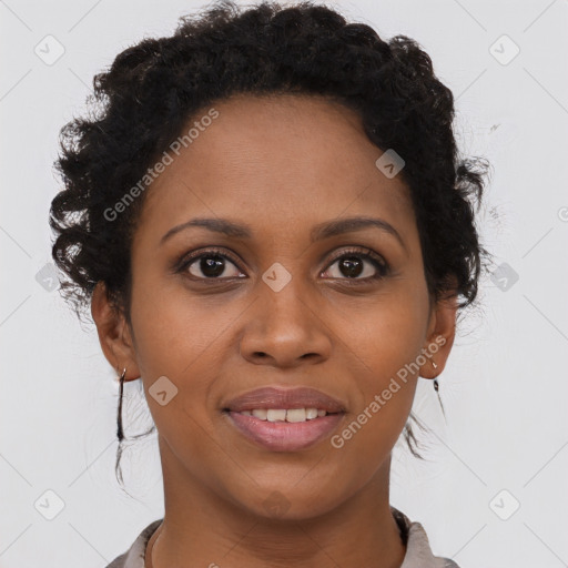 Joyful black young-adult female with long  brown hair and brown eyes