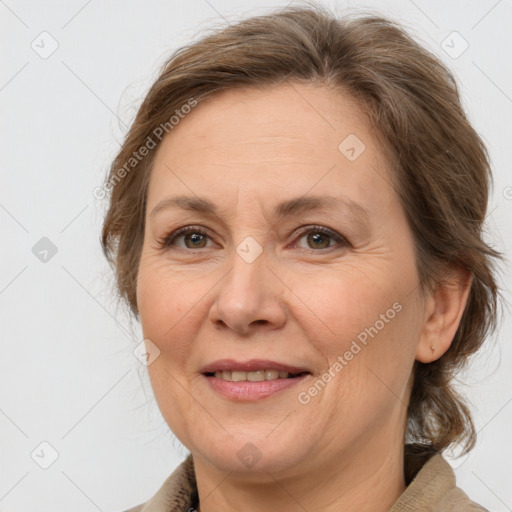 Joyful white adult female with medium  brown hair and brown eyes