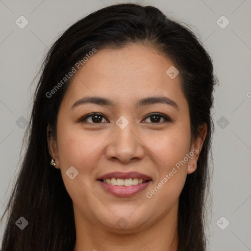 Joyful latino young-adult female with long  brown hair and brown eyes