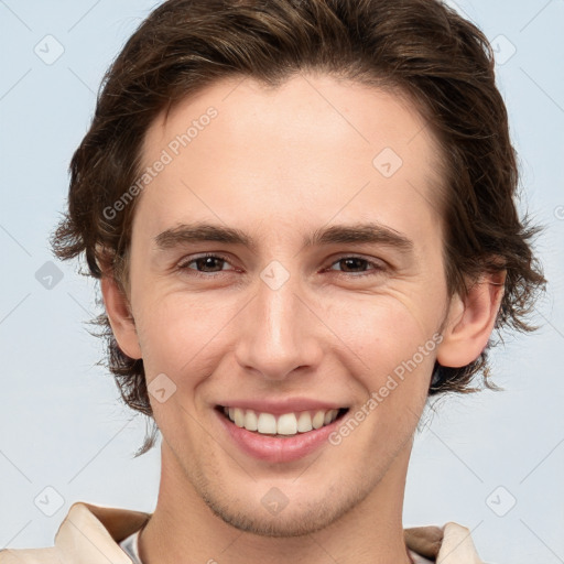 Joyful white young-adult male with medium  brown hair and brown eyes