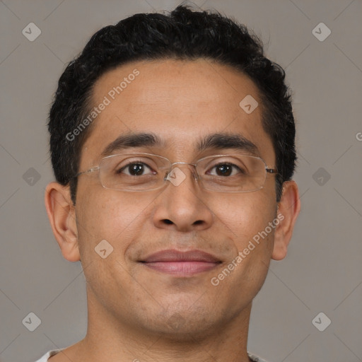 Joyful latino adult male with short  brown hair and brown eyes