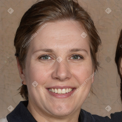 Joyful white adult female with medium  brown hair and grey eyes