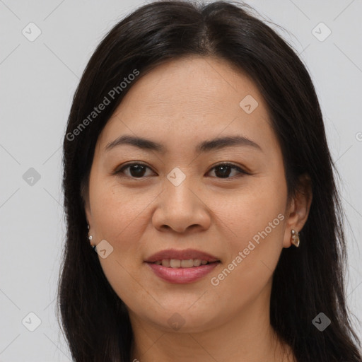 Joyful asian young-adult female with long  brown hair and brown eyes