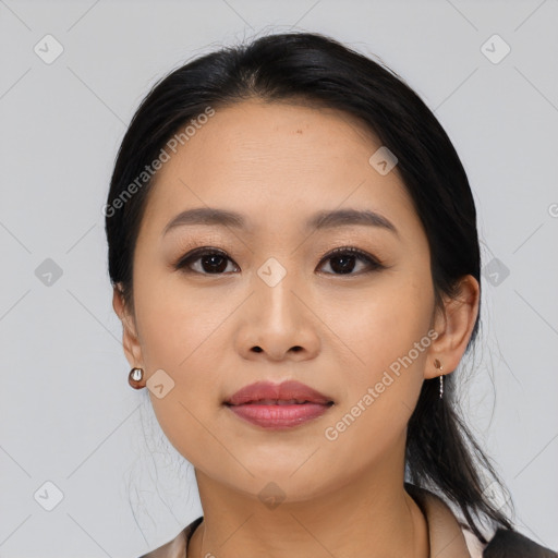 Joyful asian young-adult female with medium  black hair and brown eyes