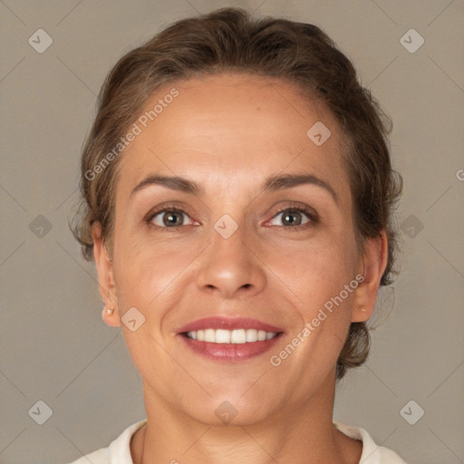 Joyful white adult female with short  brown hair and brown eyes