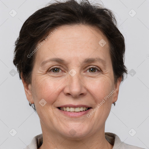 Joyful white adult female with short  brown hair and brown eyes