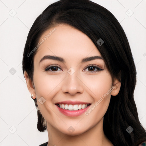 Joyful white young-adult female with long  black hair and brown eyes