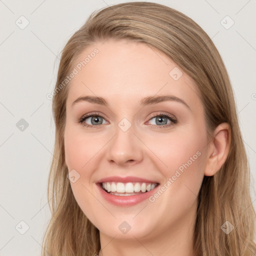 Joyful white young-adult female with long  brown hair and blue eyes