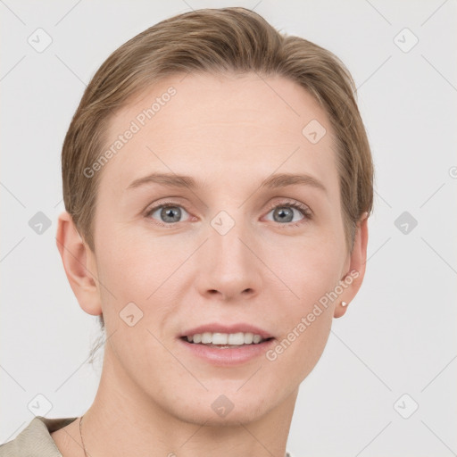 Joyful white young-adult female with short  brown hair and grey eyes