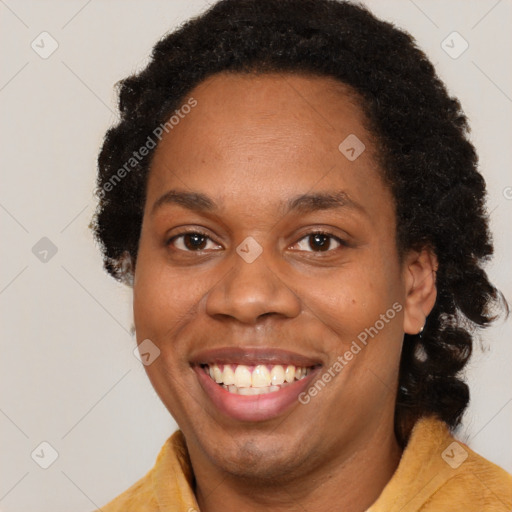 Joyful black young-adult female with medium  brown hair and brown eyes