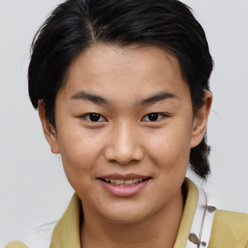 Joyful asian young-adult female with short  brown hair and brown eyes