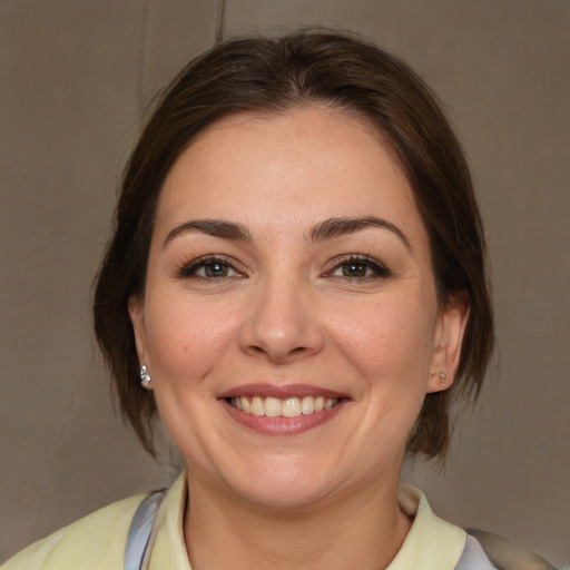 Joyful white young-adult female with medium  brown hair and brown eyes