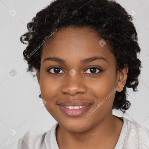 Joyful black young-adult female with long  black hair and brown eyes