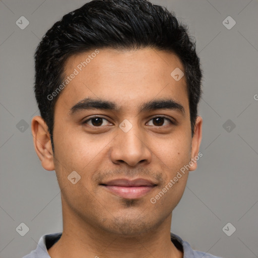 Joyful latino young-adult male with short  black hair and brown eyes