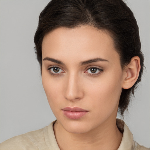 Neutral white young-adult female with medium  brown hair and brown eyes