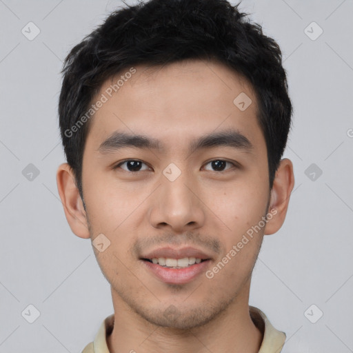 Joyful asian young-adult male with short  black hair and brown eyes