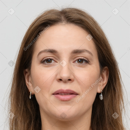 Joyful white adult female with long  brown hair and grey eyes