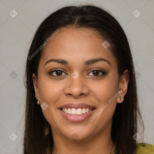 Joyful latino young-adult female with long  brown hair and brown eyes