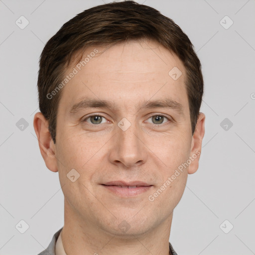 Joyful white adult male with short  brown hair and grey eyes