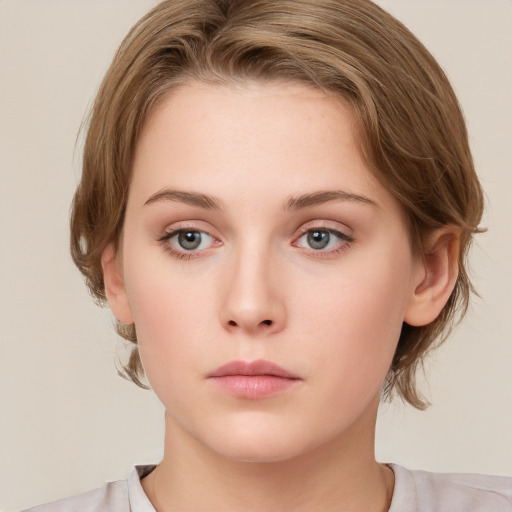 Neutral white young-adult female with medium  brown hair and grey eyes