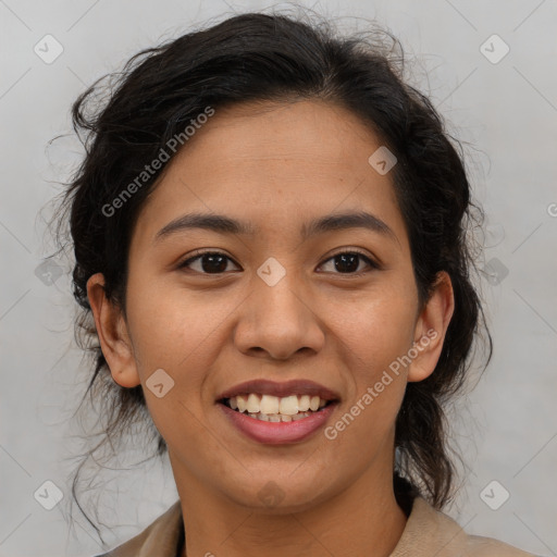 Joyful latino young-adult female with medium  brown hair and brown eyes