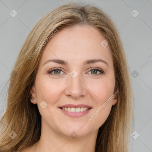 Joyful white young-adult female with long  brown hair and brown eyes