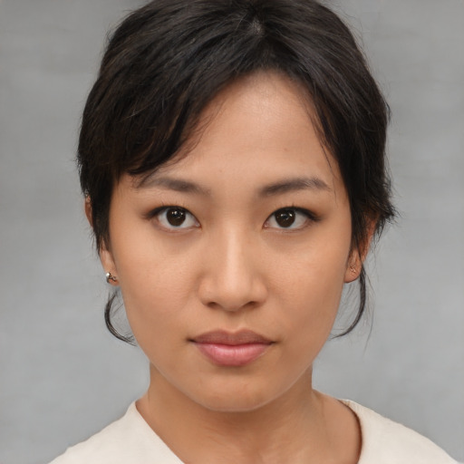 Neutral asian young-adult female with medium  brown hair and brown eyes