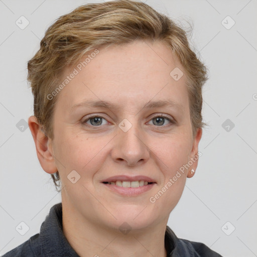 Joyful white adult female with short  brown hair and grey eyes