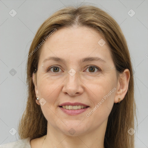 Joyful white adult female with medium  brown hair and brown eyes