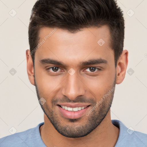 Joyful white young-adult male with short  brown hair and brown eyes