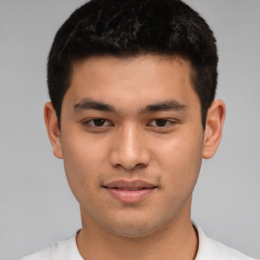 Joyful asian young-adult male with short  brown hair and brown eyes
