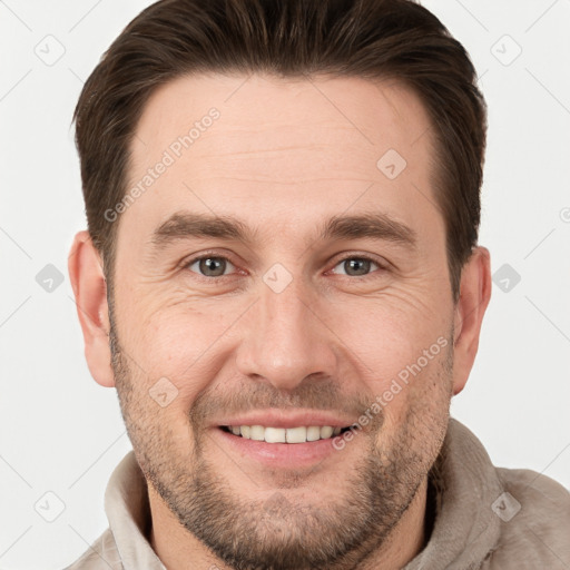 Joyful white adult male with short  brown hair and brown eyes