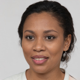 Joyful white adult female with medium  brown hair and brown eyes