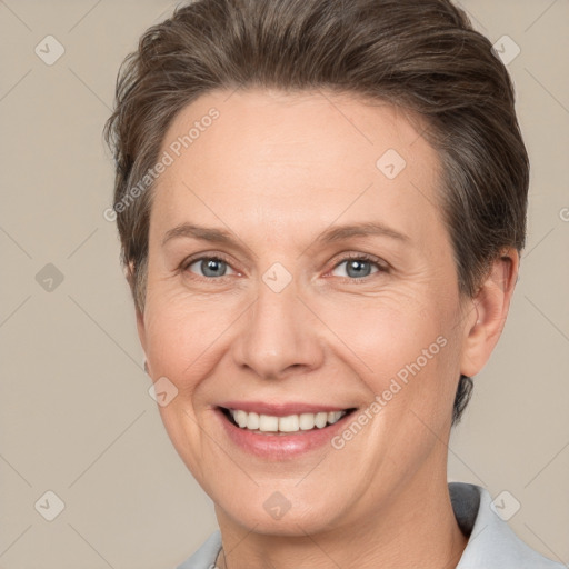 Joyful white adult female with short  brown hair and brown eyes