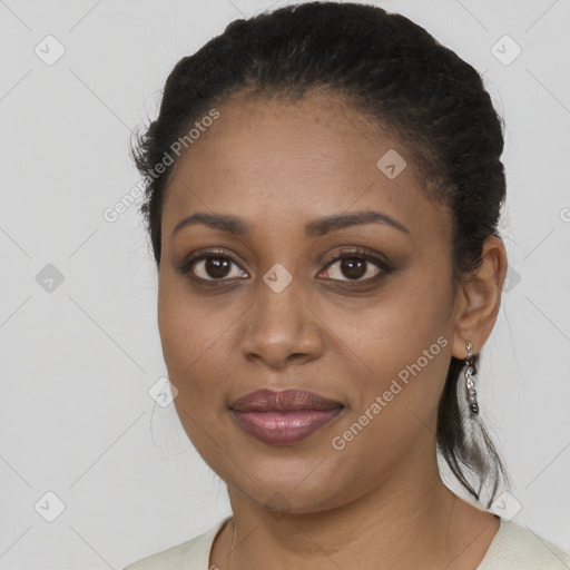 Joyful black young-adult female with medium  brown hair and brown eyes