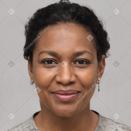 Joyful black adult female with short  brown hair and brown eyes