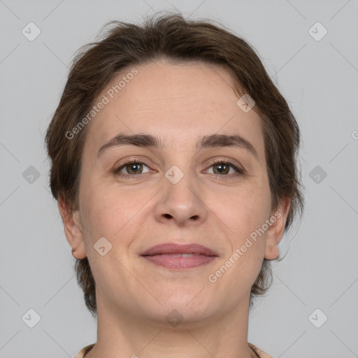 Joyful white adult female with medium  brown hair and grey eyes