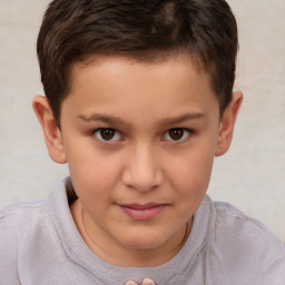 Joyful white child male with short  brown hair and brown eyes