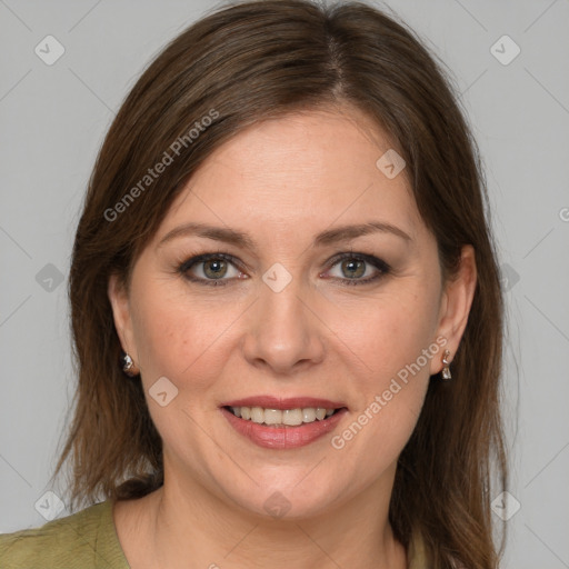 Joyful white adult female with medium  brown hair and grey eyes