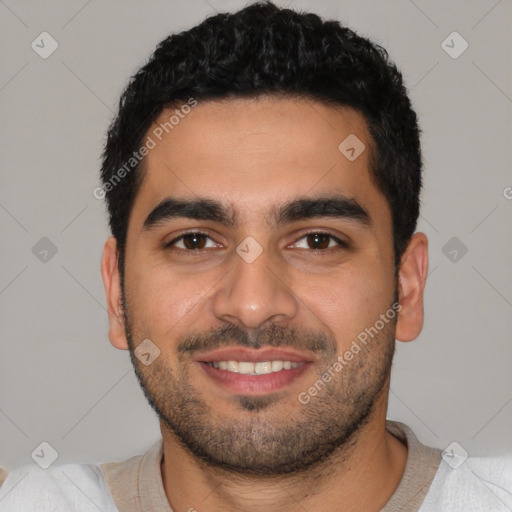 Joyful latino young-adult male with short  black hair and brown eyes