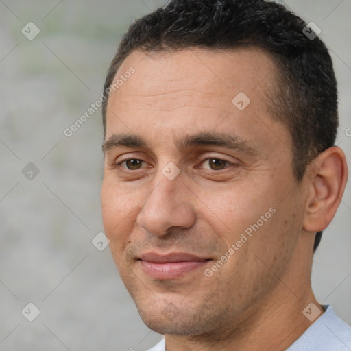 Joyful white adult male with short  brown hair and brown eyes