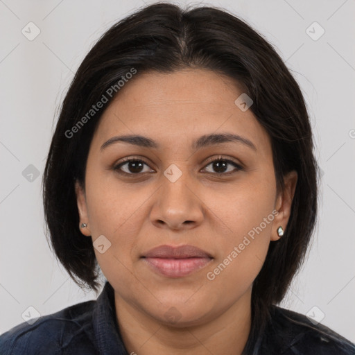 Joyful latino young-adult female with long  brown hair and brown eyes