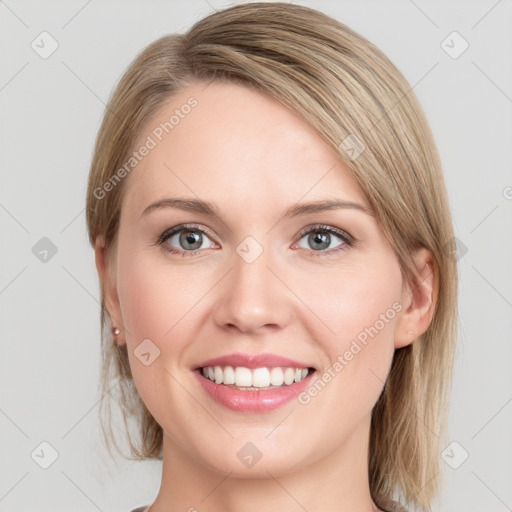 Joyful white young-adult female with medium  brown hair and blue eyes