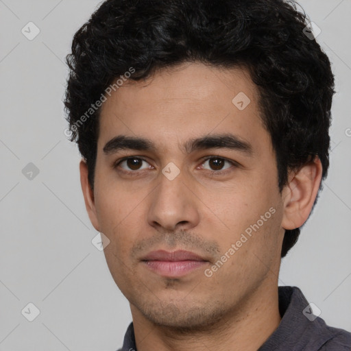 Neutral white young-adult male with short  black hair and brown eyes