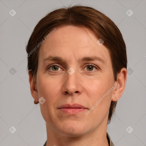 Joyful white adult female with short  brown hair and grey eyes