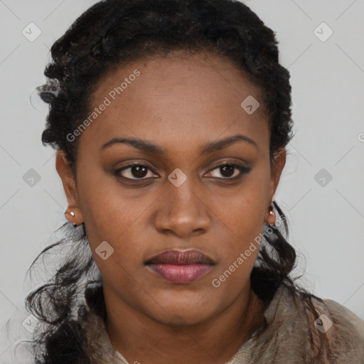 Joyful black young-adult female with long  black hair and brown eyes